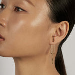 Bar Chain Ear Jacket Earrings styled in a layered ear stack