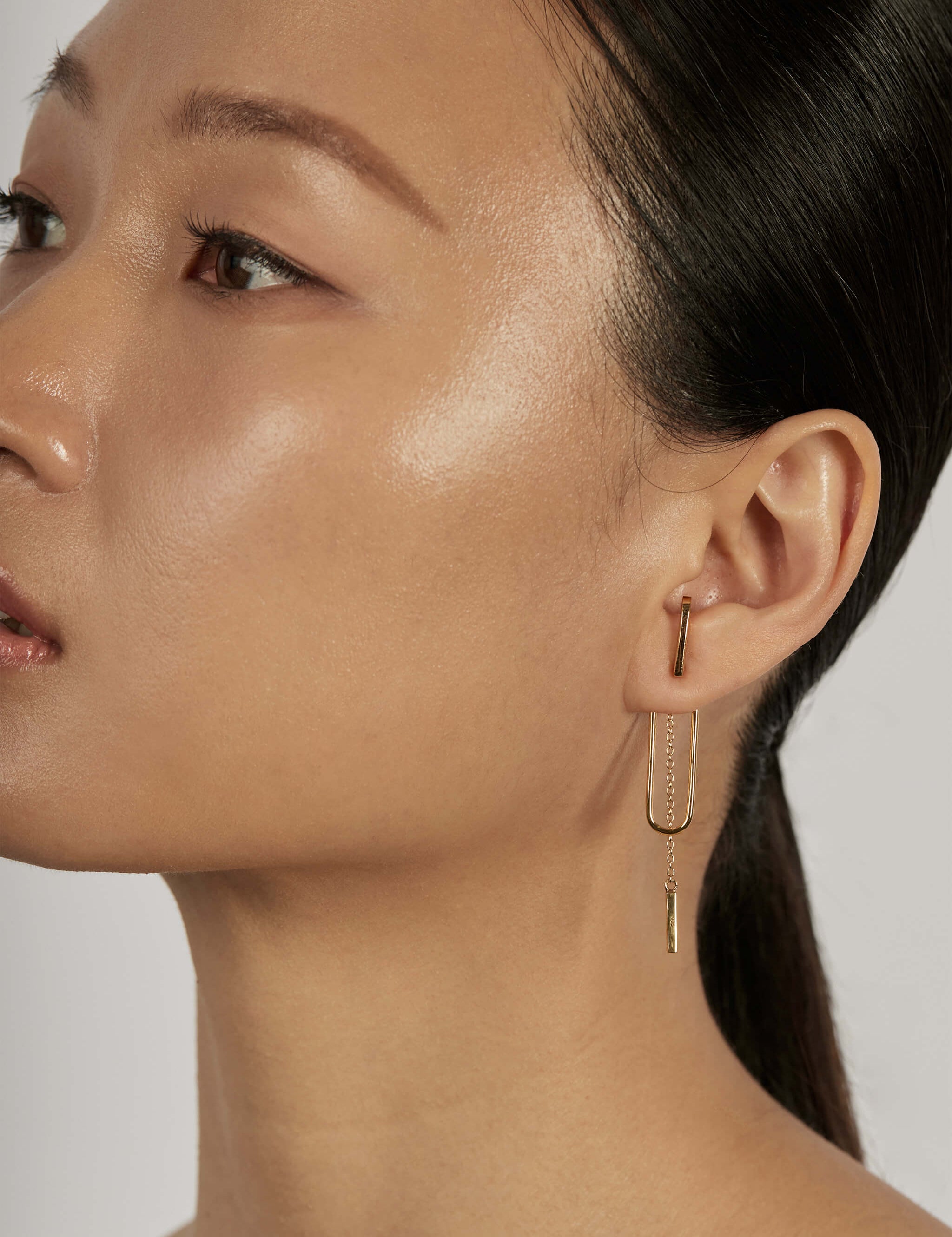 Bar Chain Ear Jacket Earrings styled in a layered ear stack