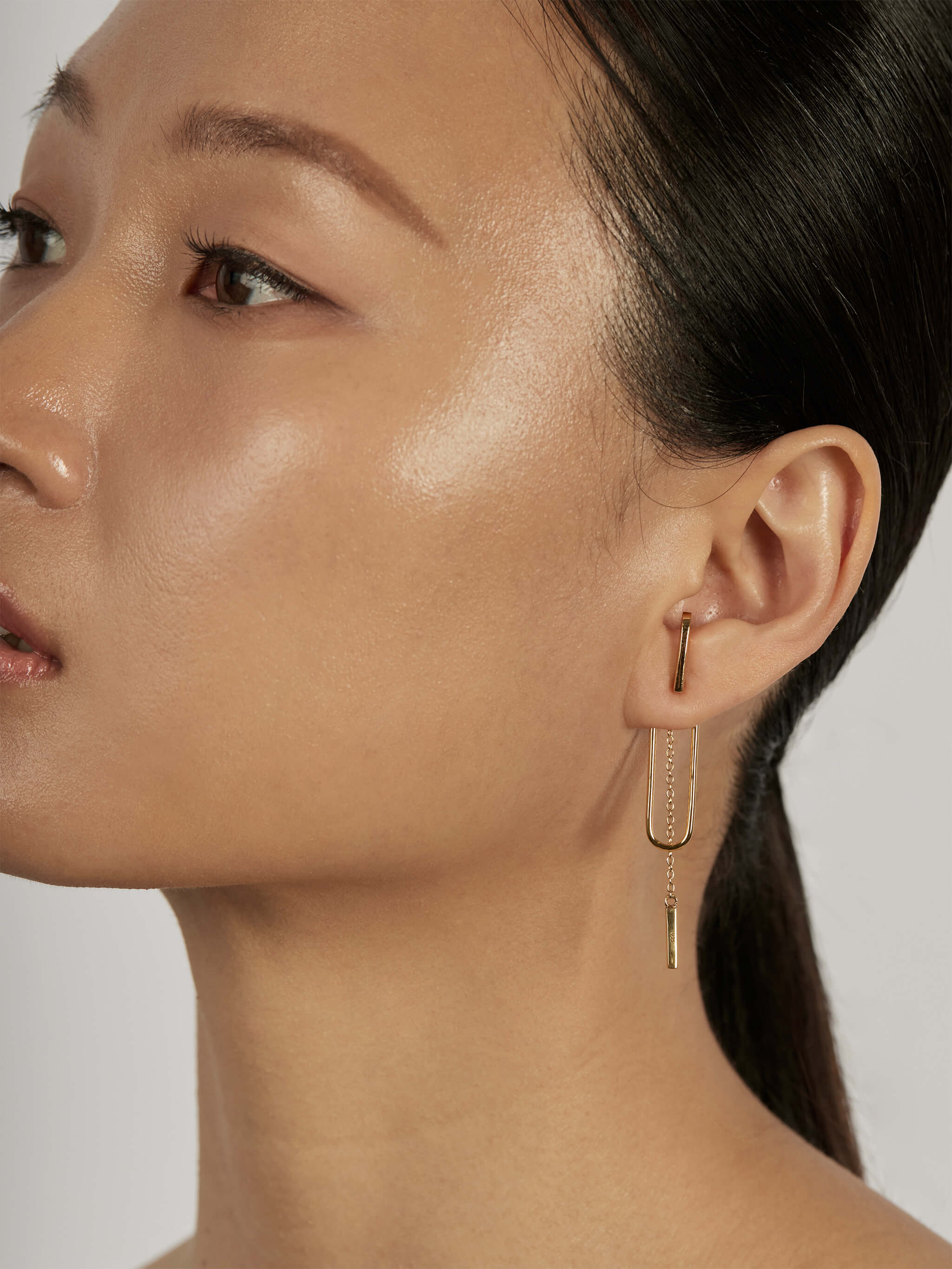 Bar Chain Ear Jacket Earrings styled in a layered ear stack