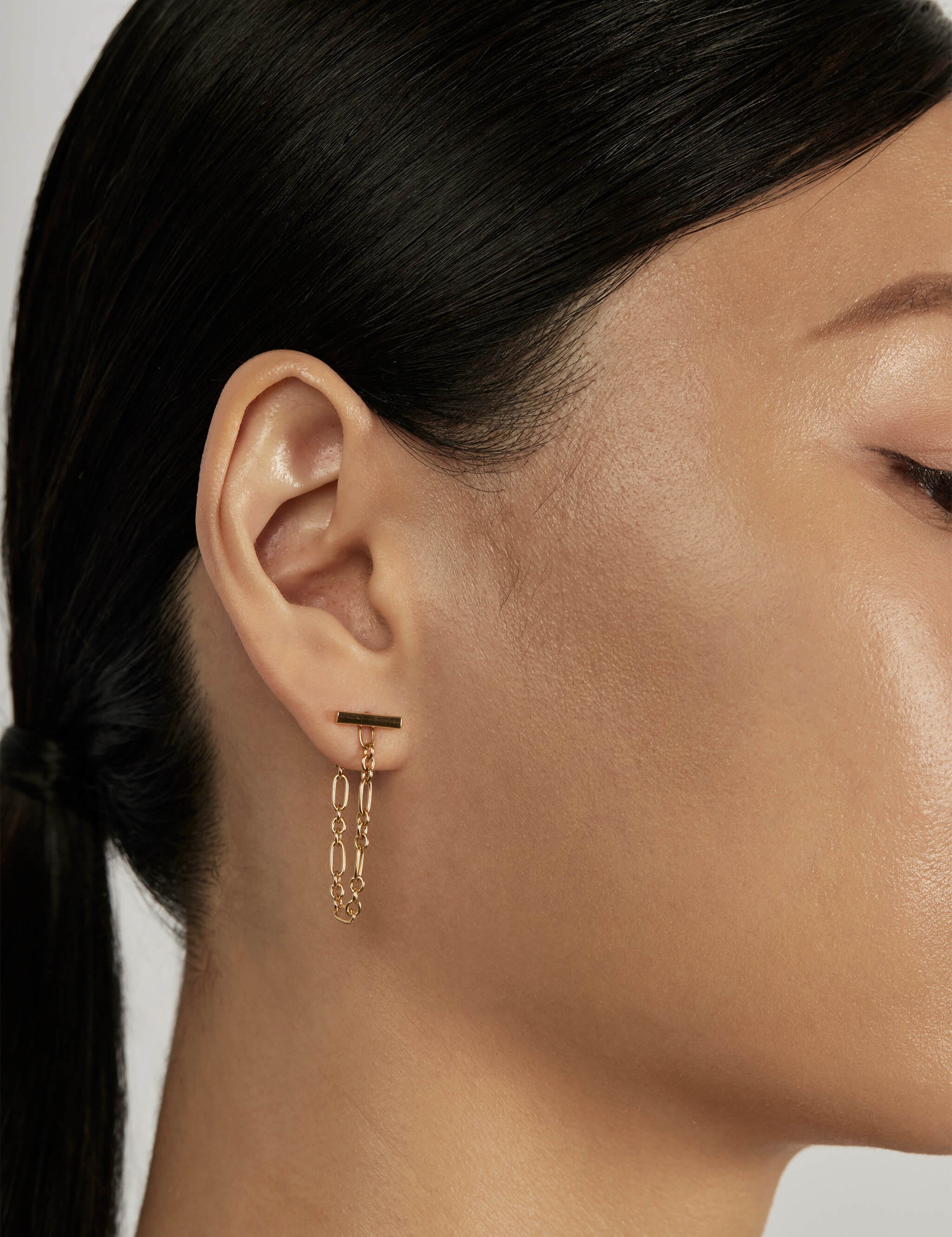 Classic Bar Stud Earrings styled in a layered ear stack