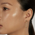 Classic Bar Stud Earrings styled in a minimal ear stack