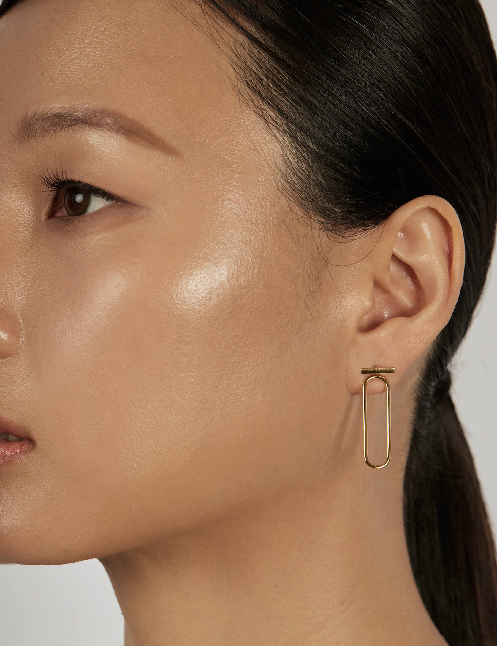 Classic Bar Stud Earrings styled in a minimal ear stack