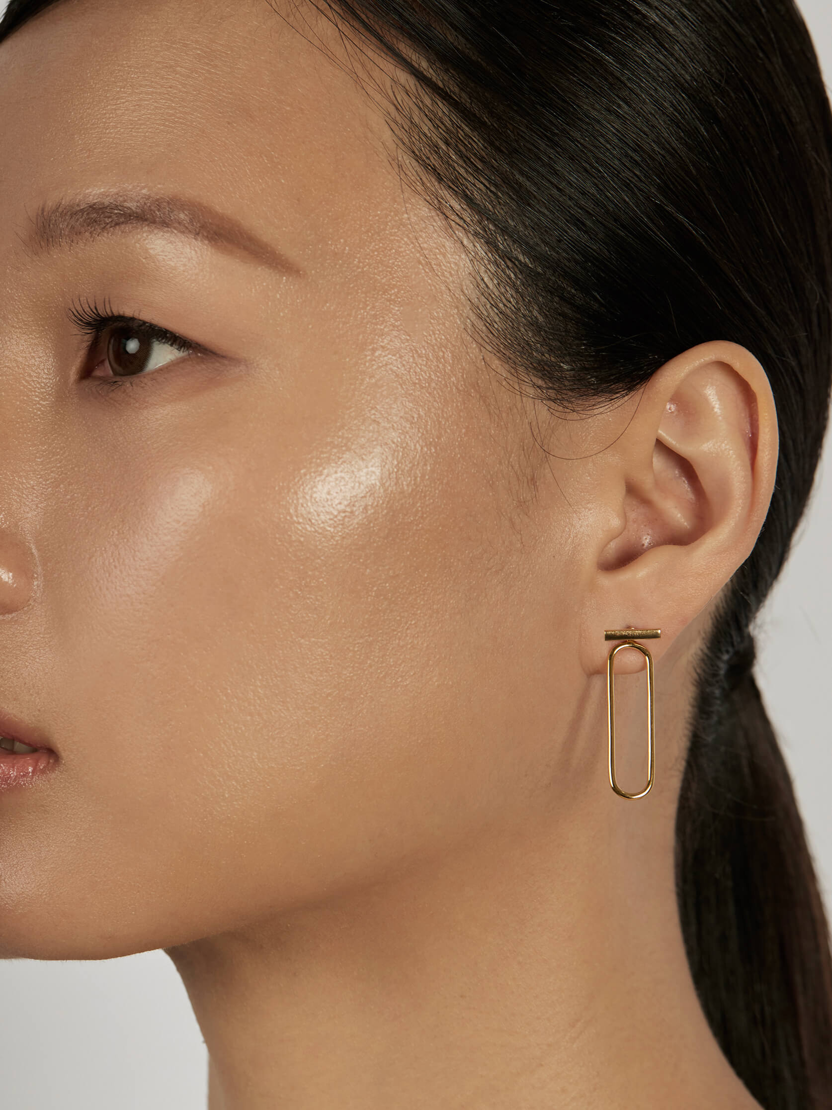 Classic Bar Stud Earrings styled in a minimal ear stack