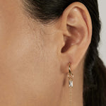 Classic Huggie Earrings with stacked charms closed-up view