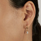 Classic Huggie Earrings with stacked charms closed-up view