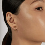 Halo Ear Jacket Earrings styled with gold sphere