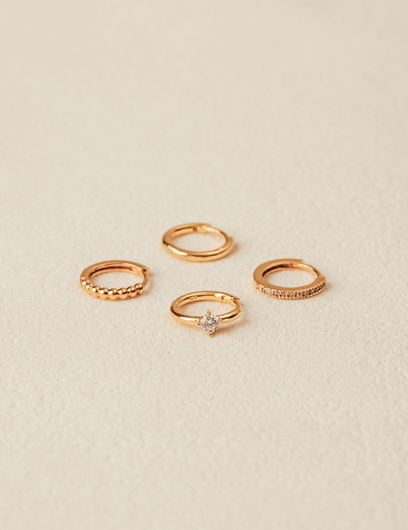 Huggie earrings collection in gold vermeil