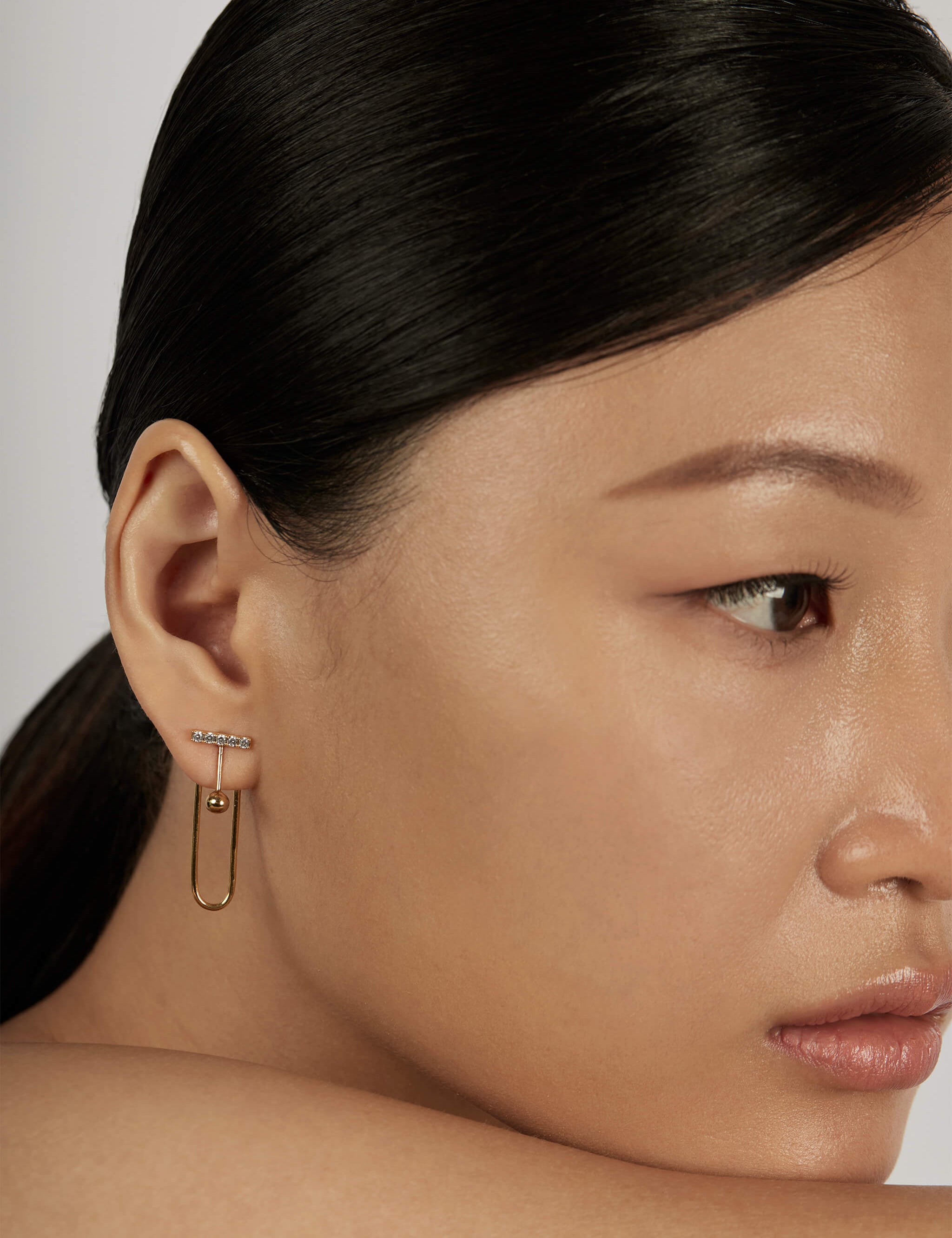 Pave Bar Stud Earrings styled in a layered ear stack