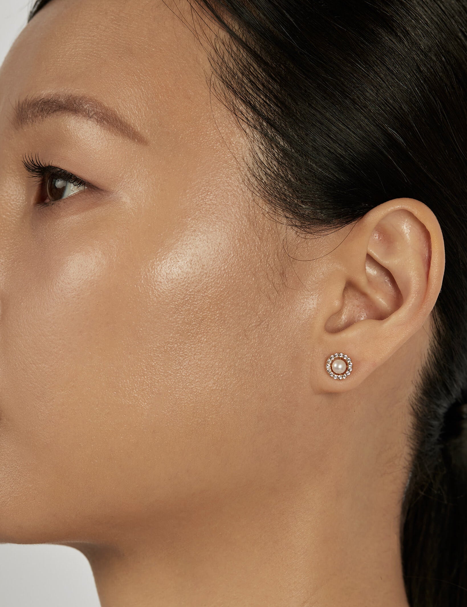 Pearl Stud Earrings styled in a minimal ear stack