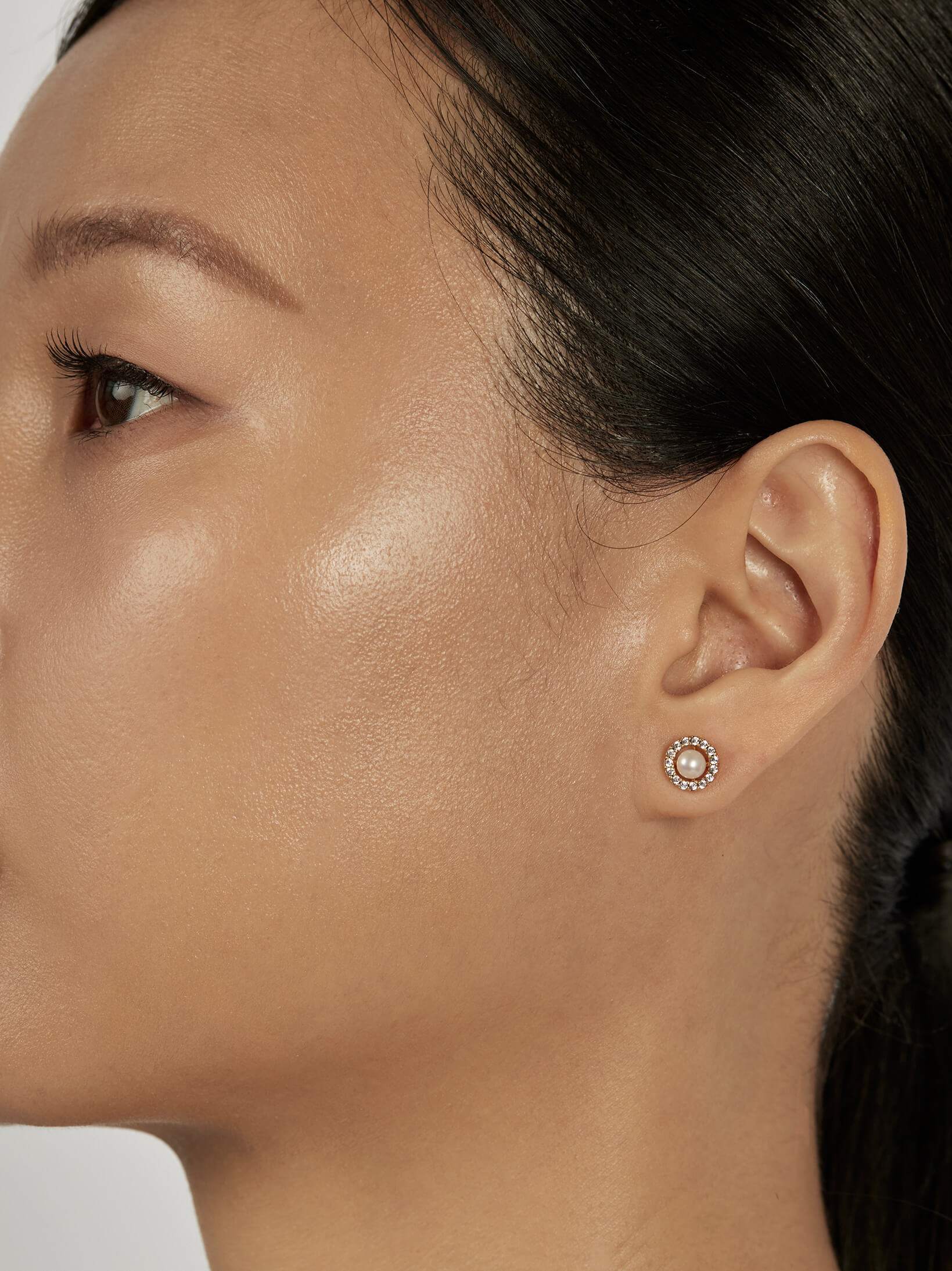 Pearl Stud Earrings styled in a minimal ear stack