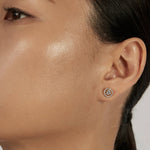 Solitaire Stud Earrings styled in a statement ear stack