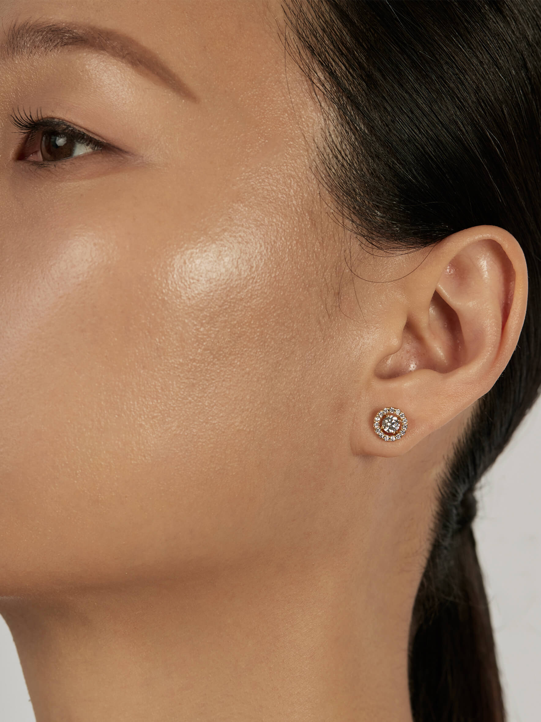 Solitaire Stud Earrings styled in a statement ear stack