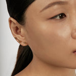 Sphere Drop Ear Jacket Earrings styled in a layered ear stack