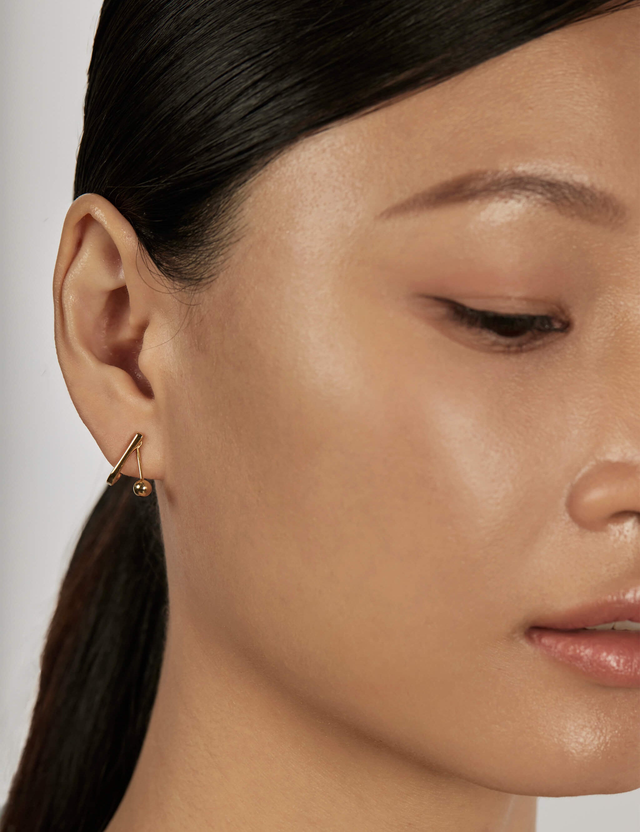 Sphere Drop Ear Jacket Earrings styled in a minimal ear stack