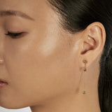 Sphere Stud Earrings styled in a layered ear stack