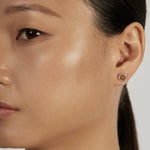 Sphere Stud Earrings styled in a minimal ear stack