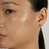 Sphere Stud Earrings styled in a minimal ear stack
