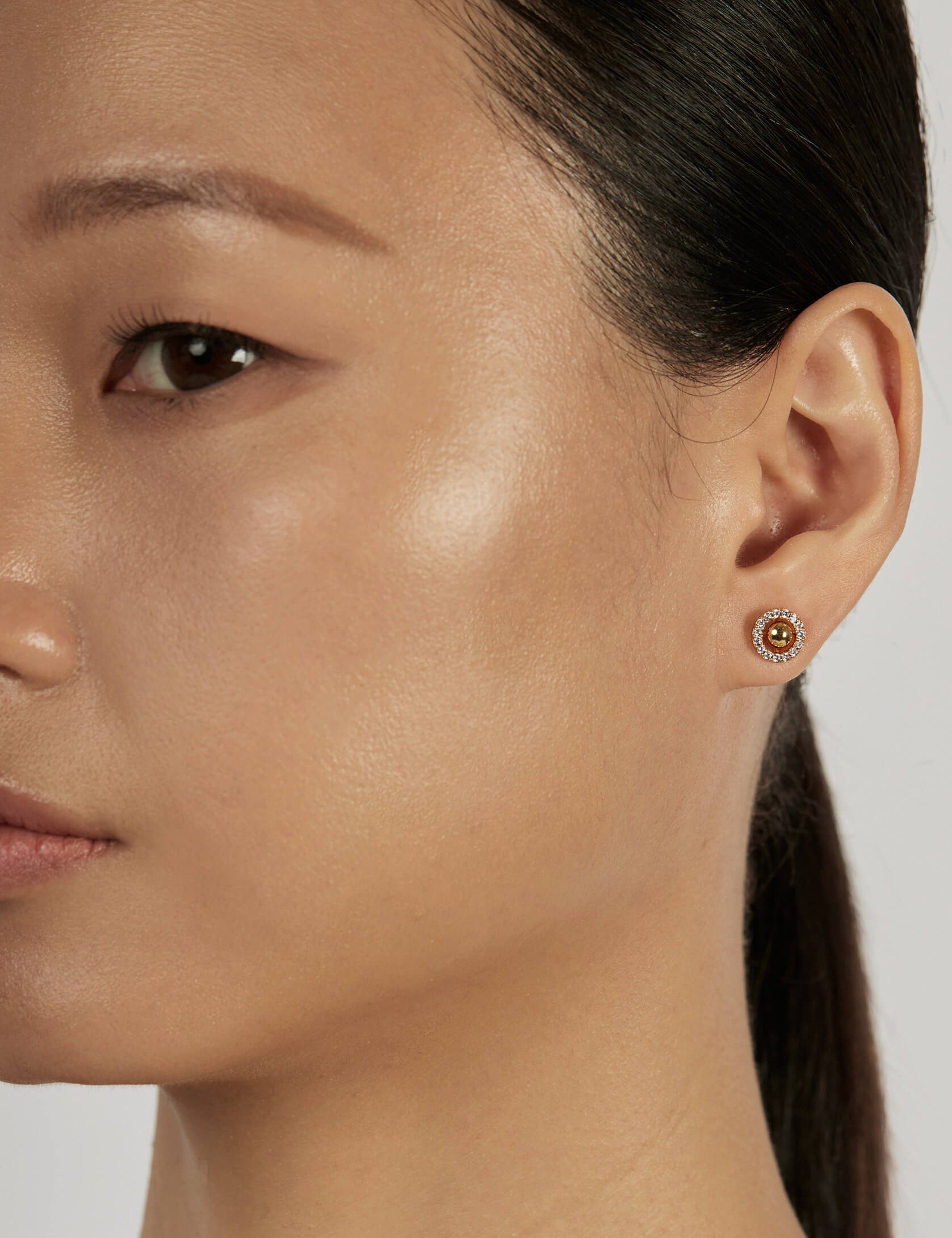 Sphere Stud Earrings styled in a minimal ear stack