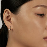 Suspend Bar Stud Earrings styled in a minimal ear stack