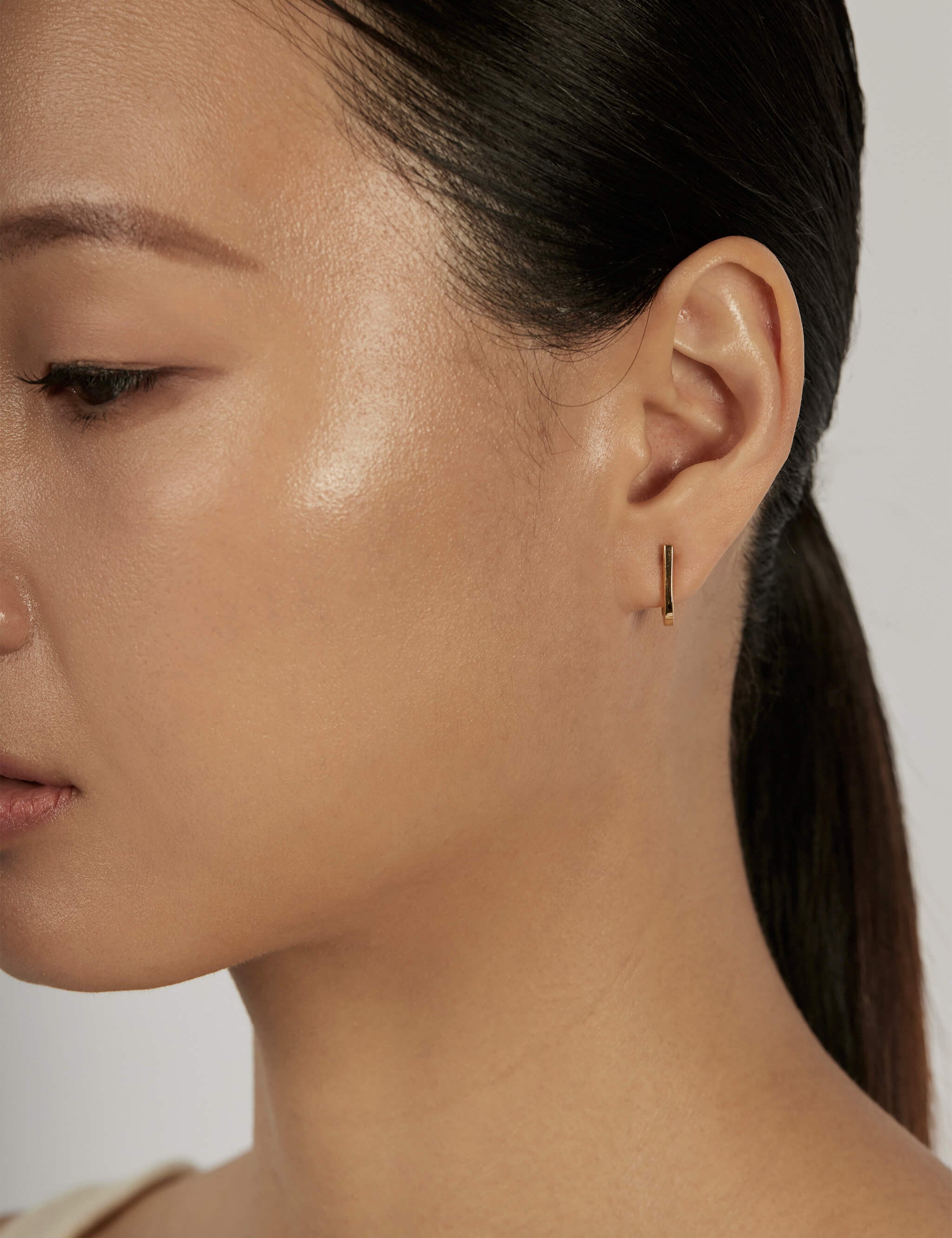 Suspend Bar Stud Earrings worn solo