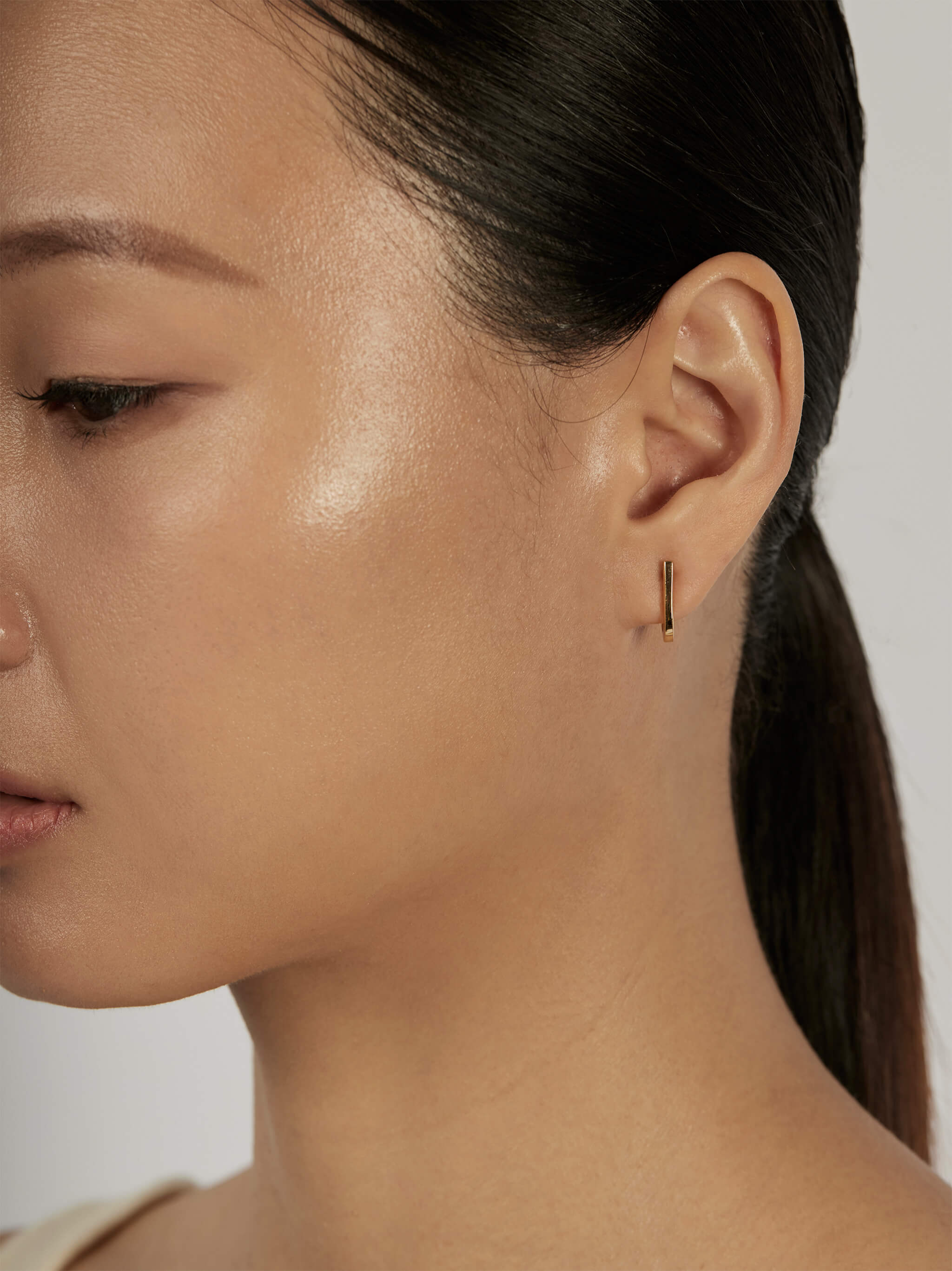 Suspend Bar Stud Earrings worn solo