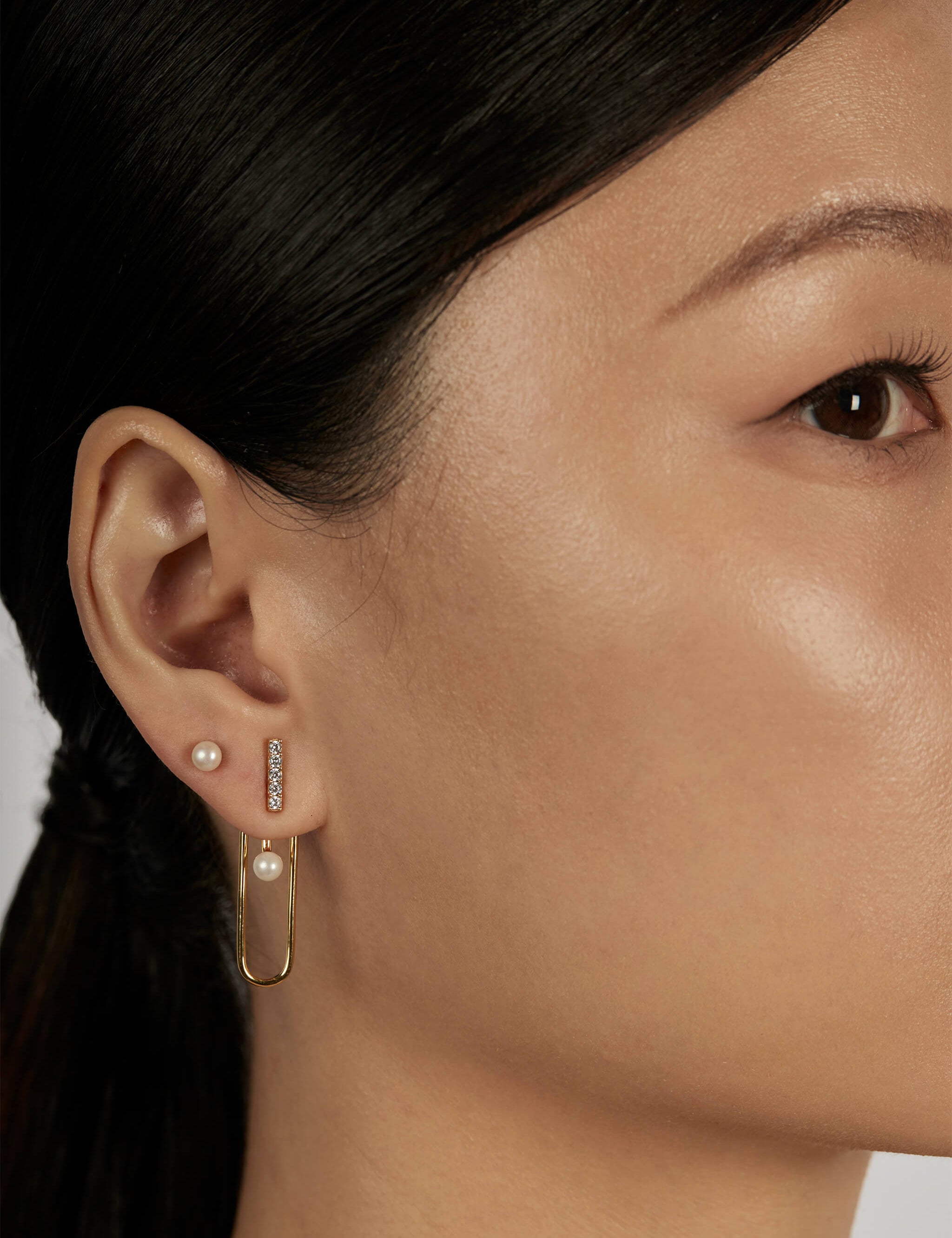 The Column Earrings worn in a complete set