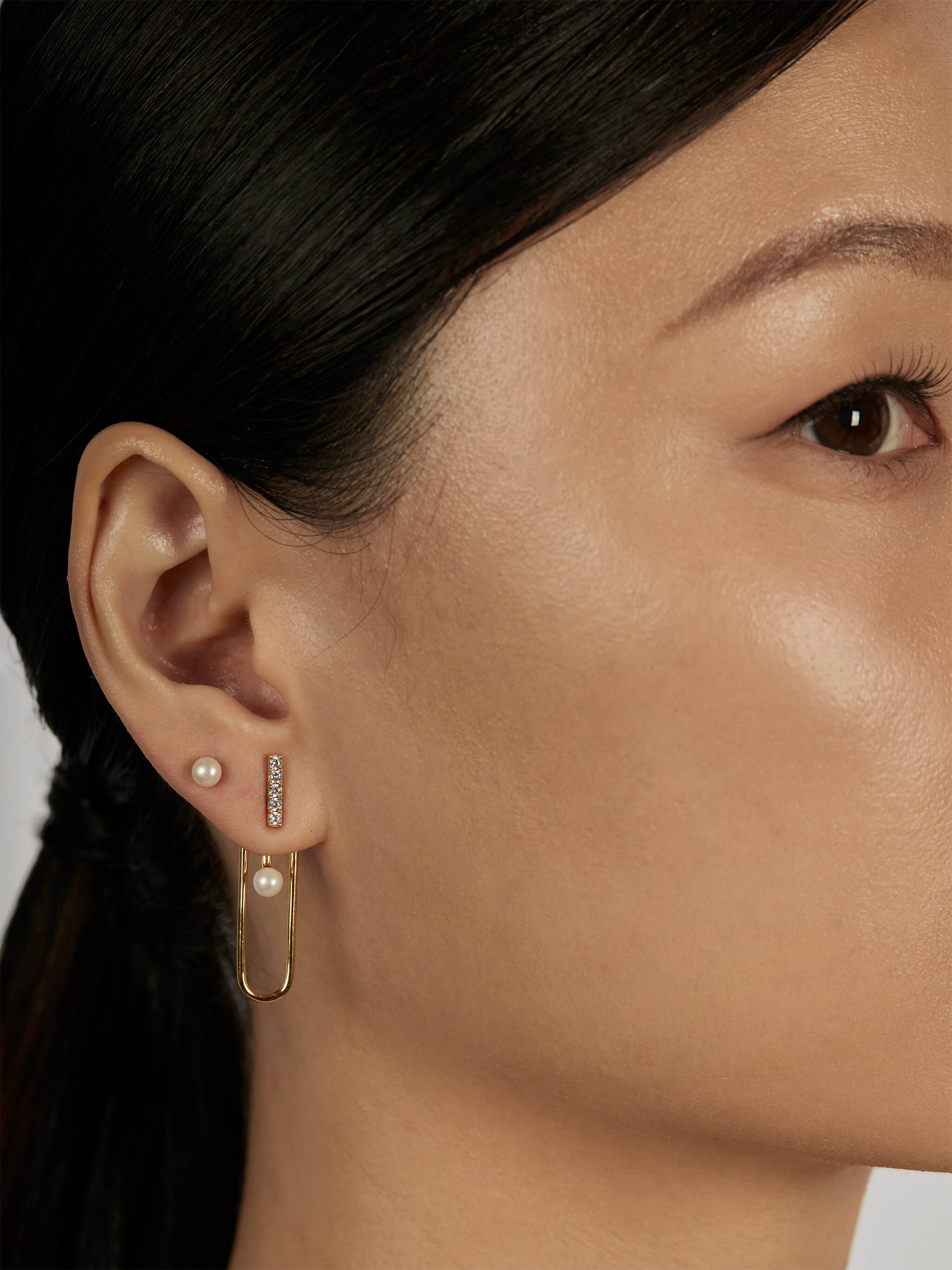 The Column Earrings worn in a complete set