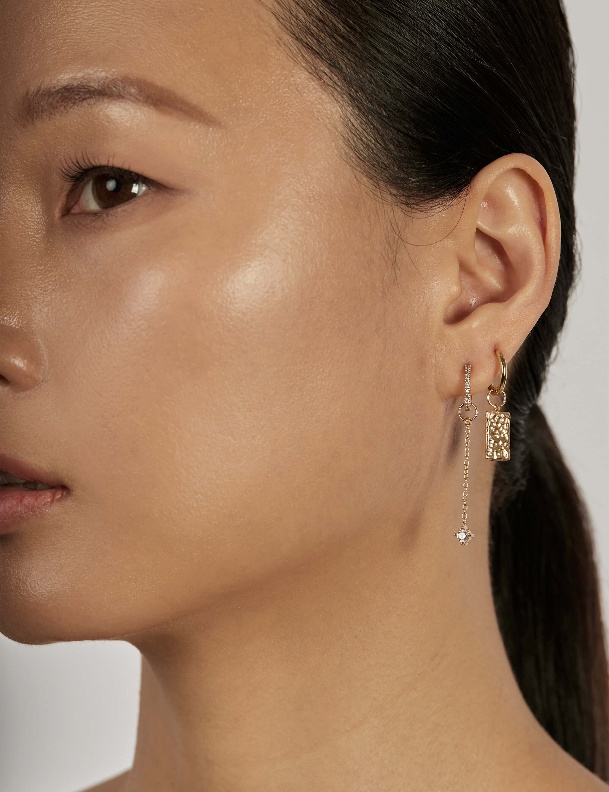 The Counterpoint Earrings worn in a complete set