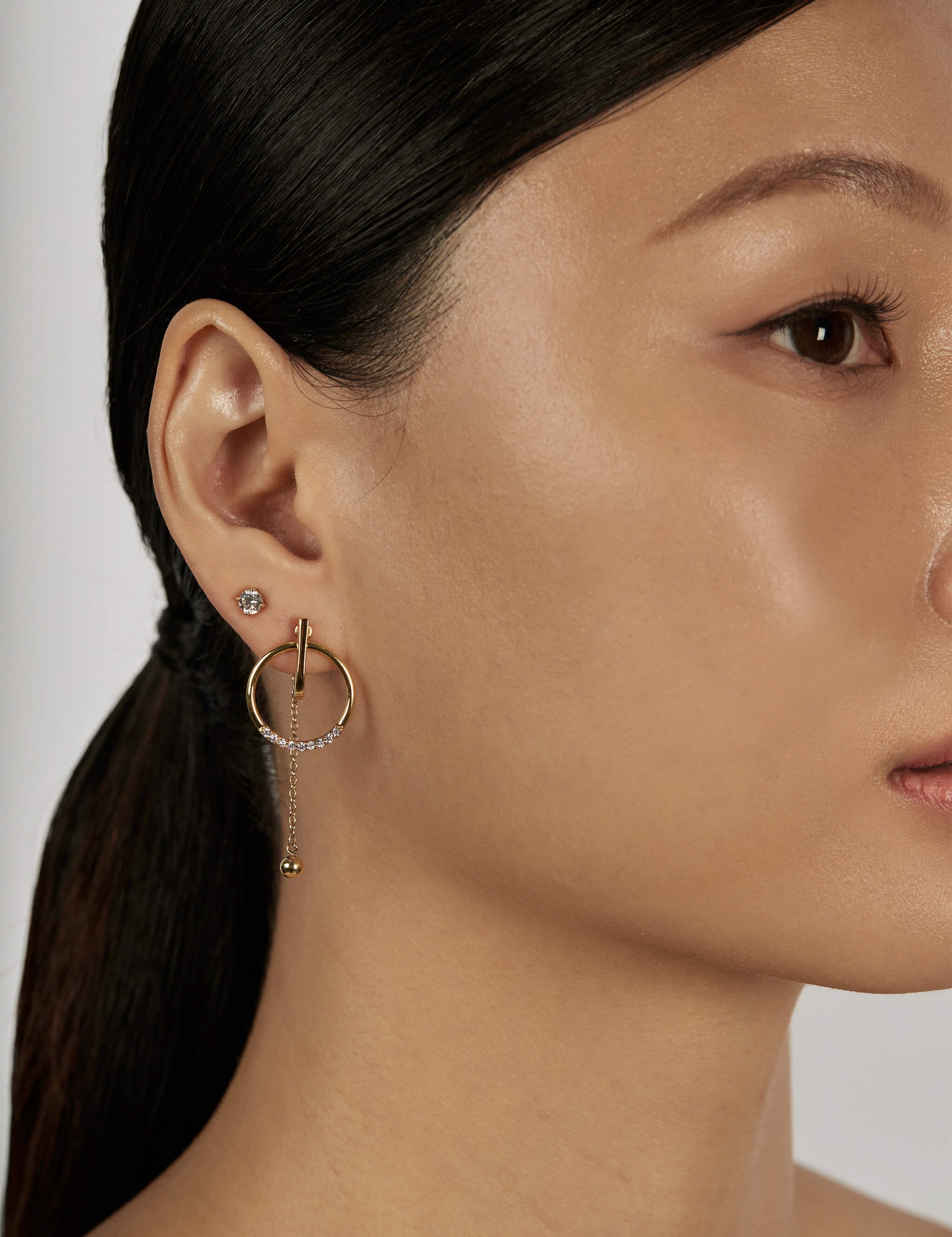 The Pendulum Earrings worn in a complete set