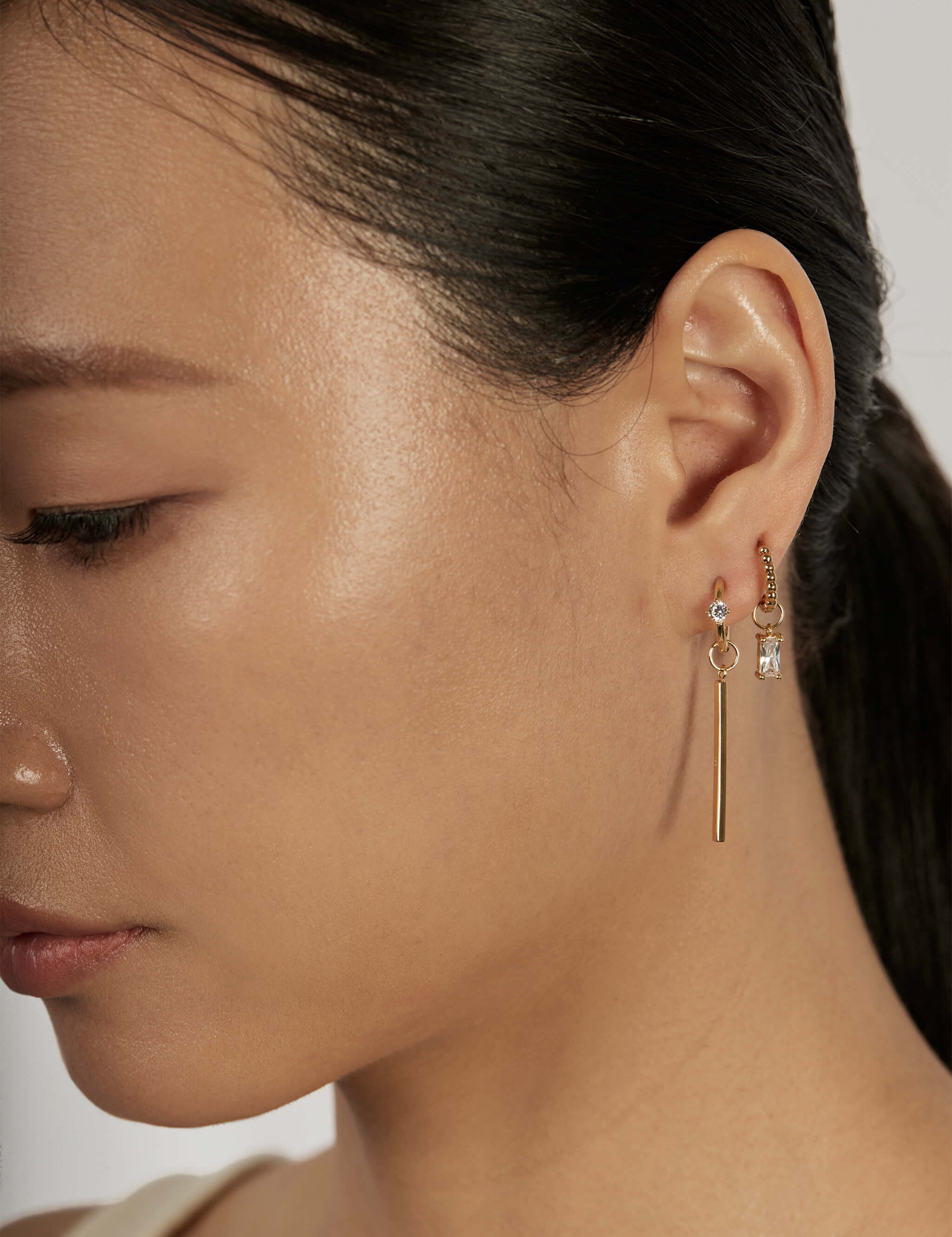 The Sparkline Earrings worn in a complete set