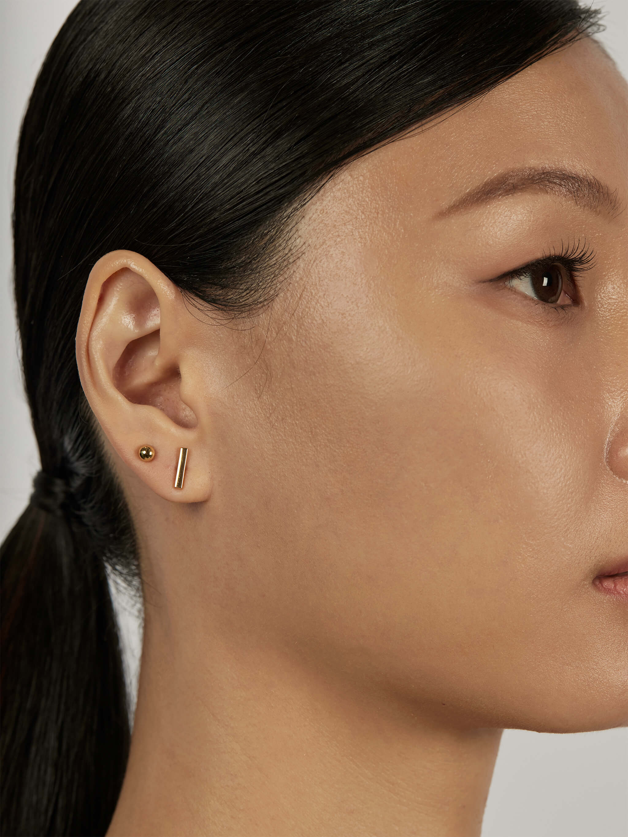 The Thread Earring Set styled in a minimal ear stack